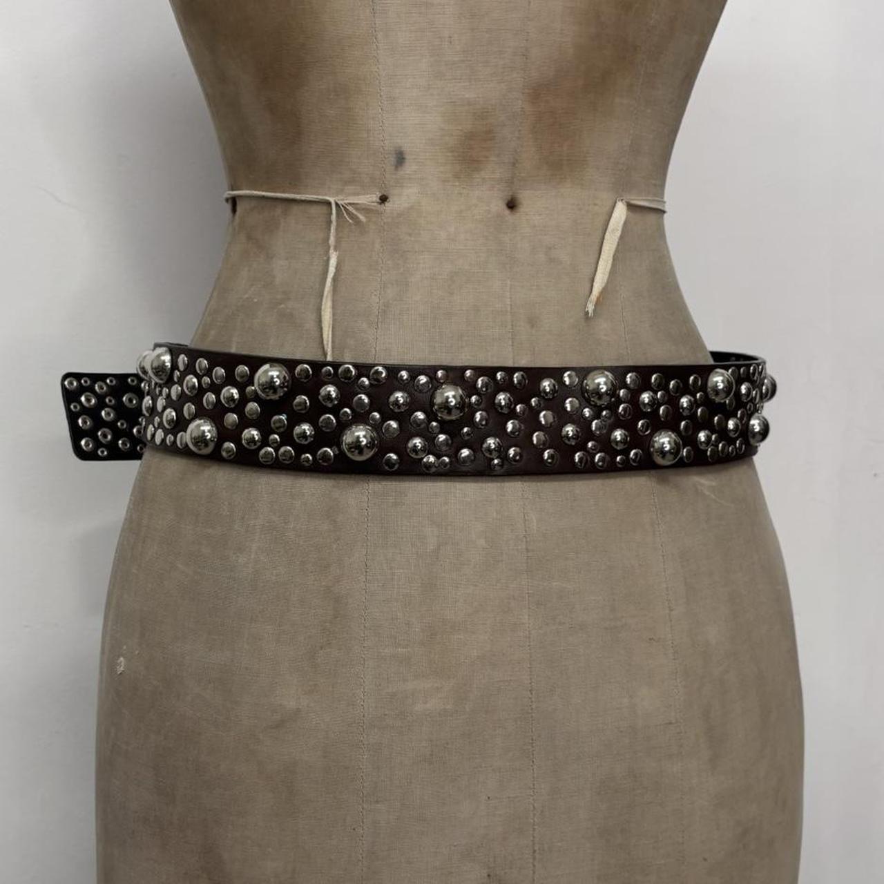 Studded silver eyelet belt