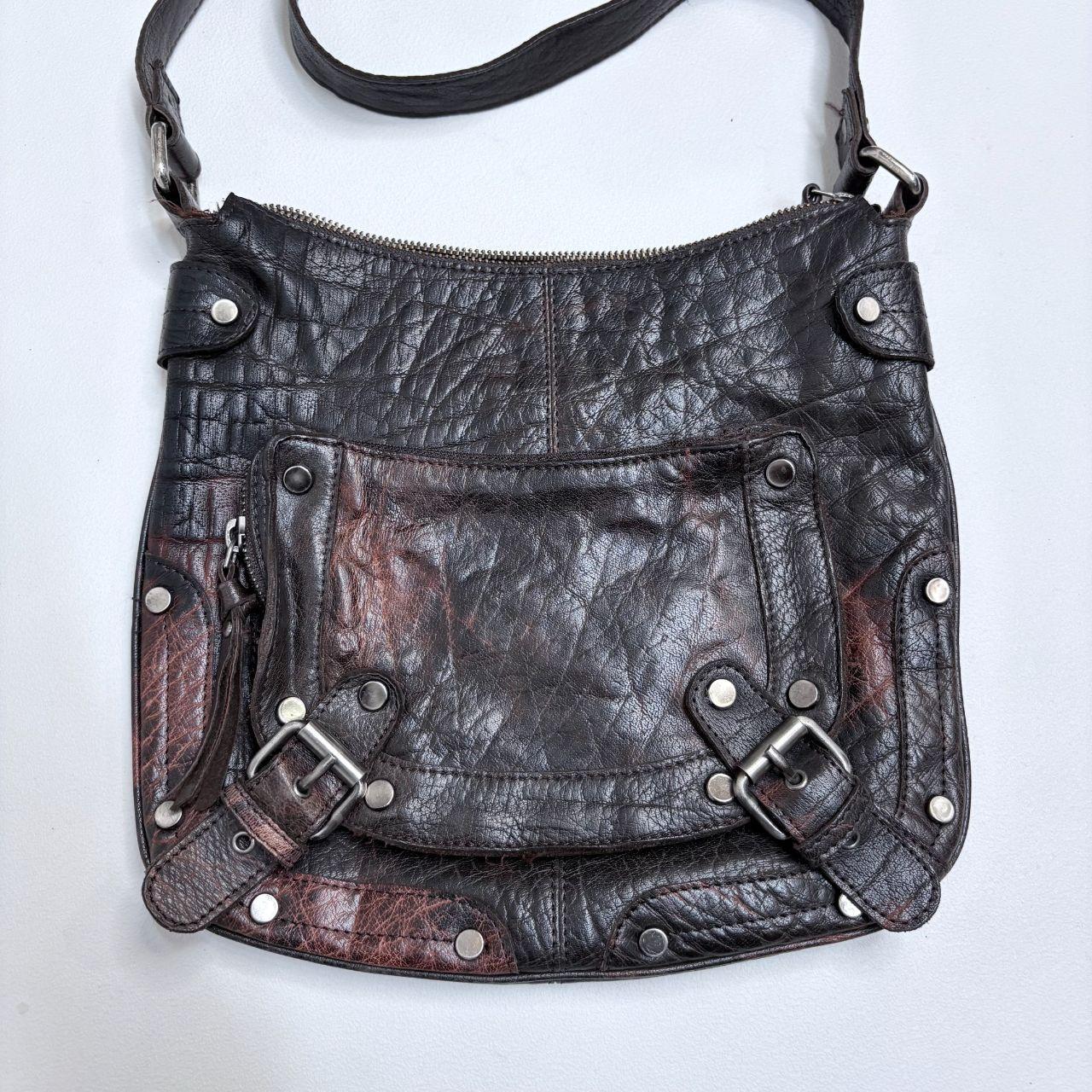 Distressed brown leather buckle studded bag