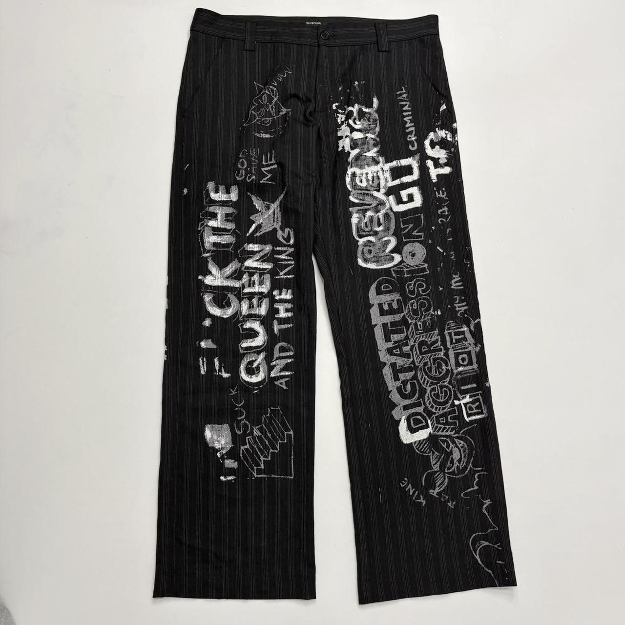 Black pinstripe graphic text trousers