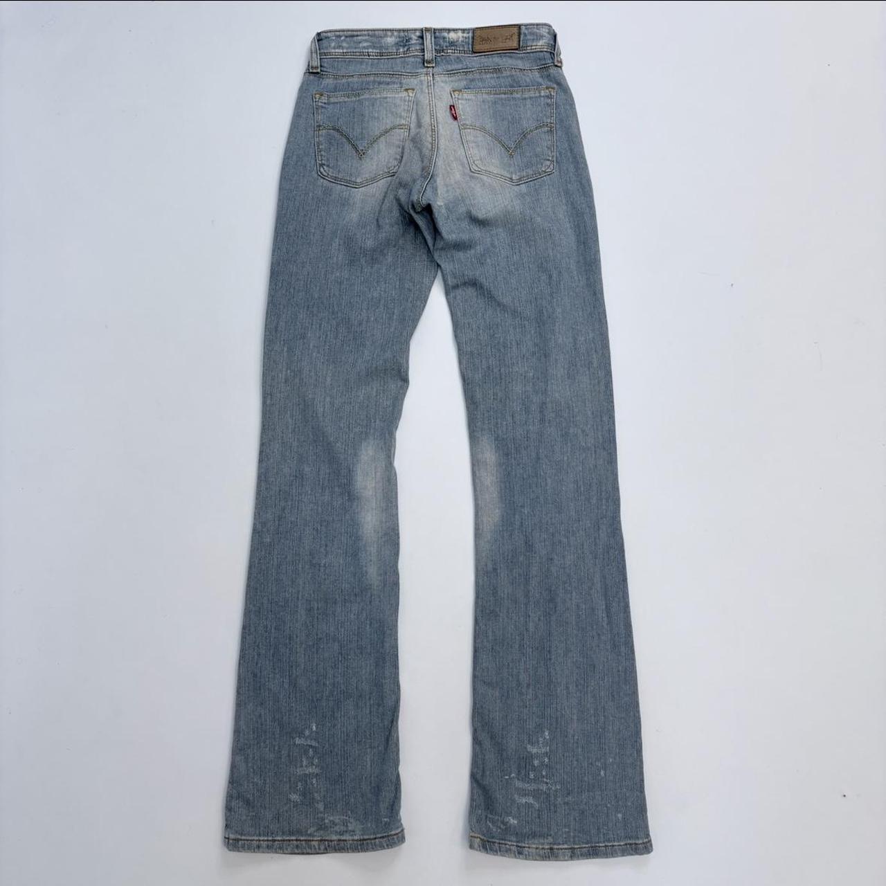 Distressed flared levi's jeans