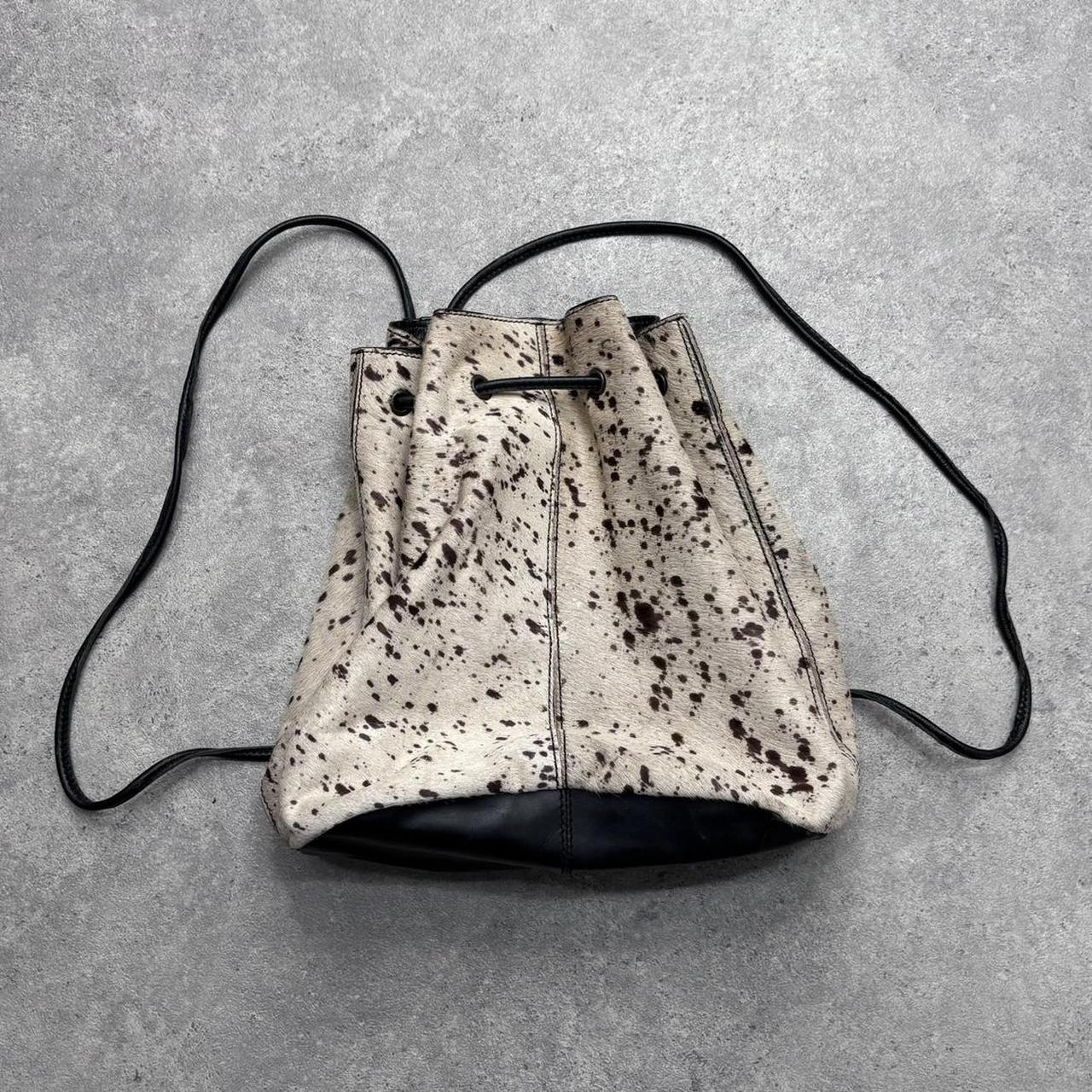 Drawstring cowhide leather backpack