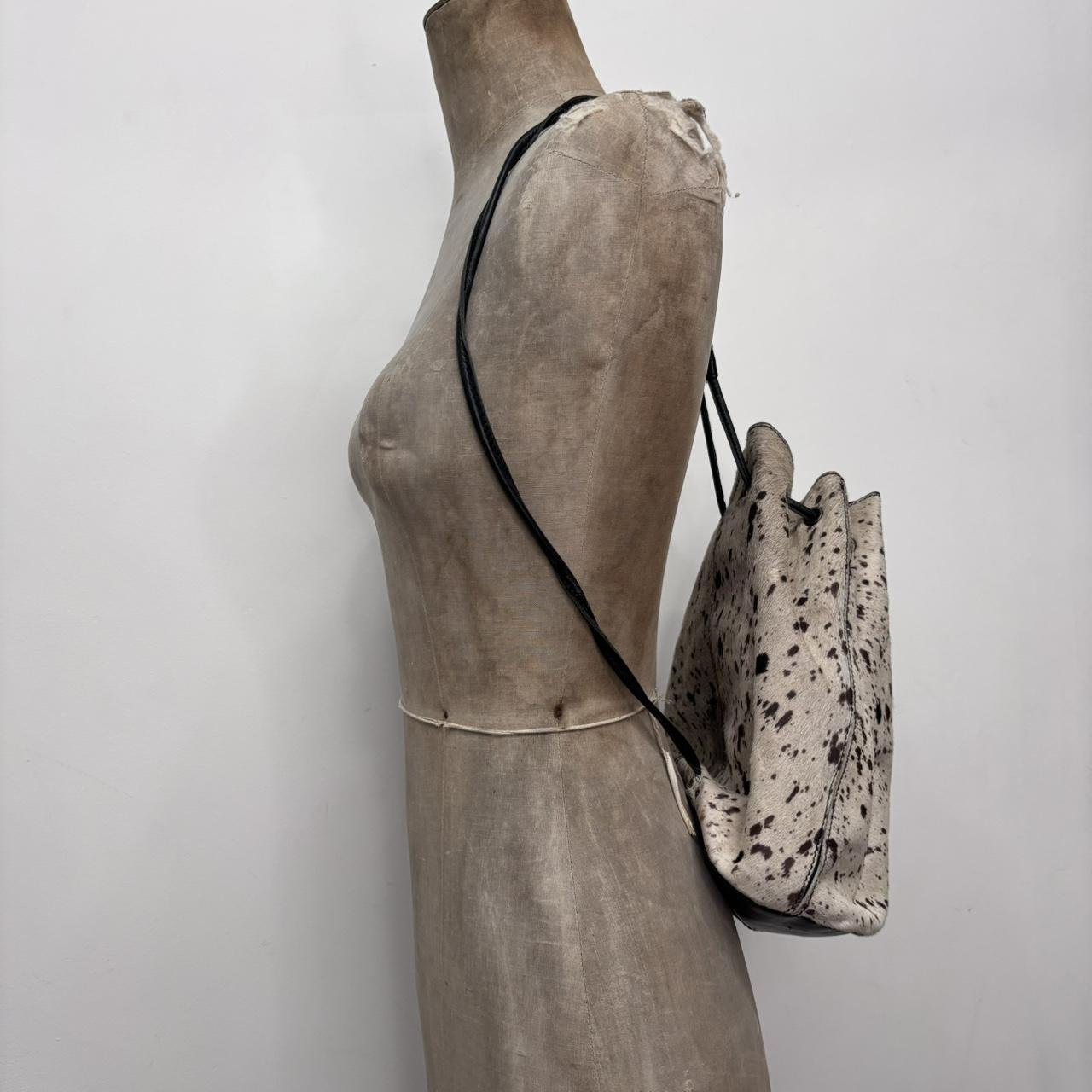 Drawstring cowhide leather backpack