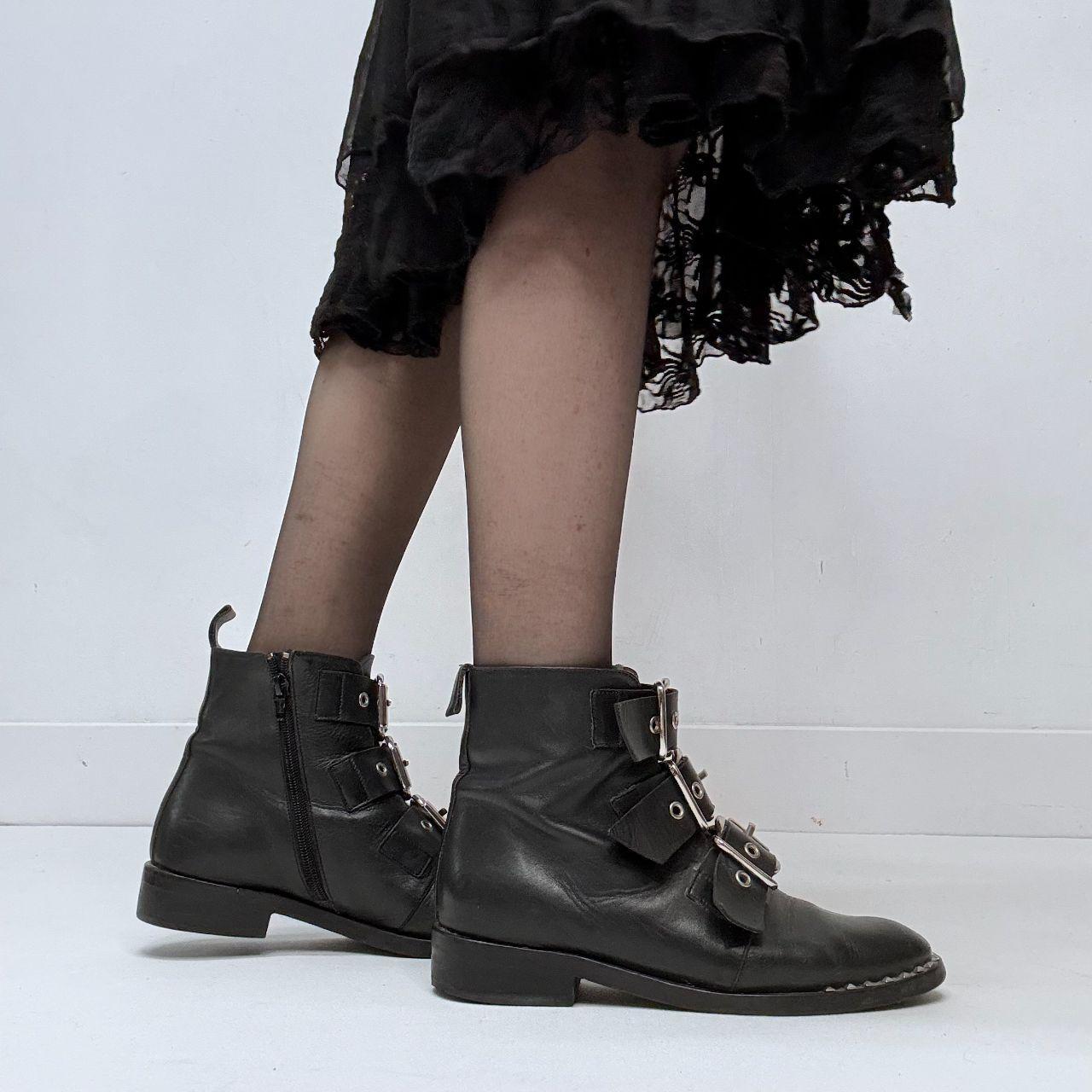 Black leather studded buckle boots