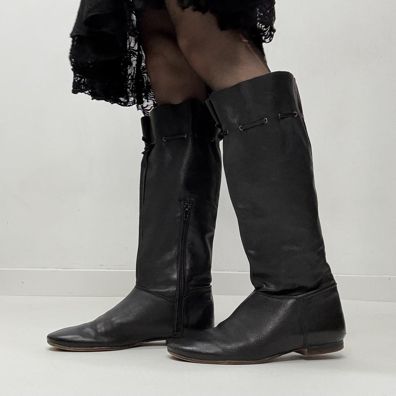 Slouchy black leather knee high boots