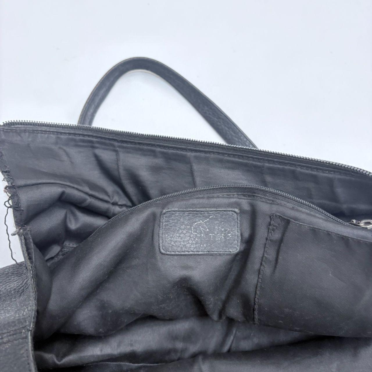 Black leather slouchy tassel bag