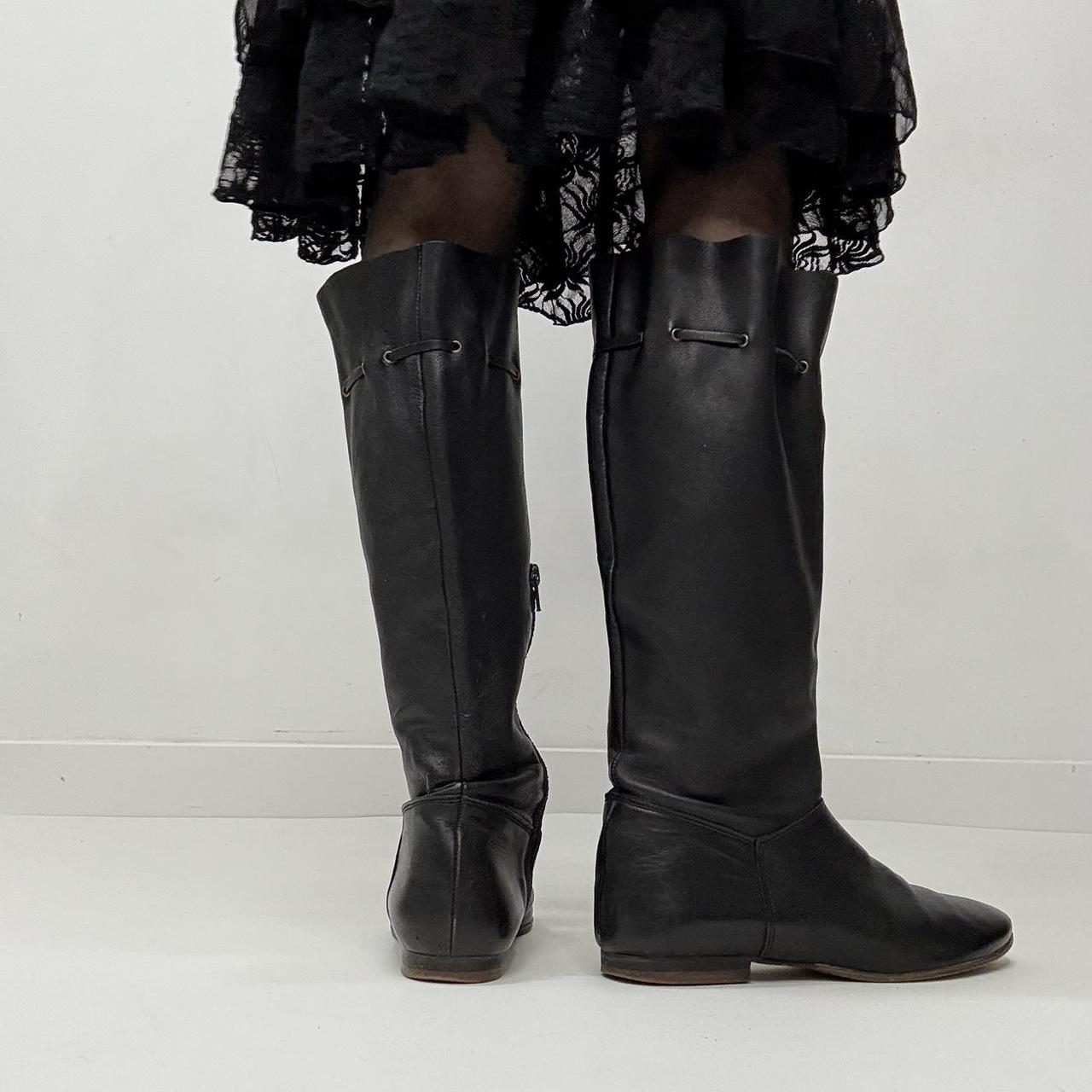 Slouchy black leather knee high boots