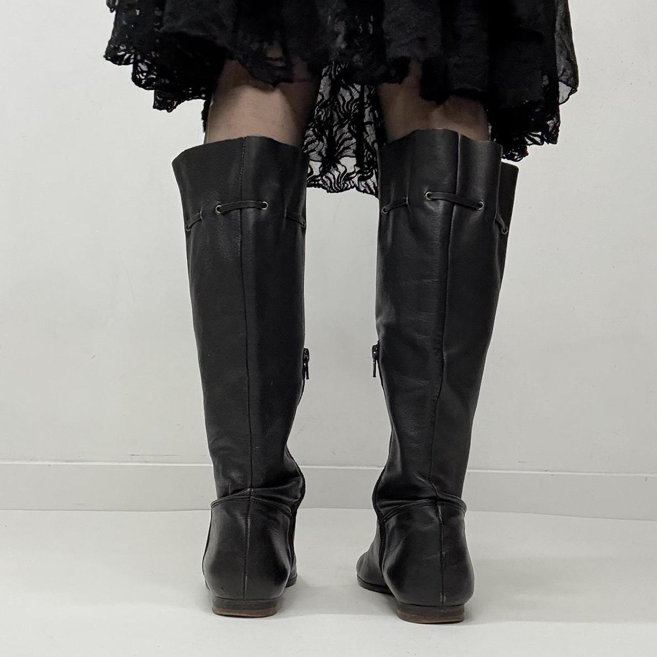 Slouchy black leather knee high boots