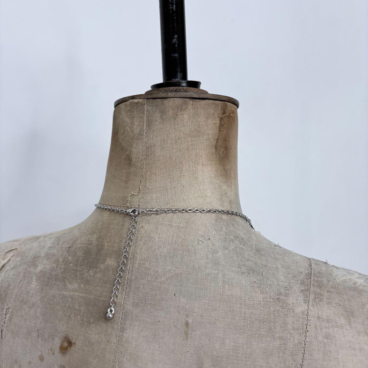 Silver coin draped chain necklace