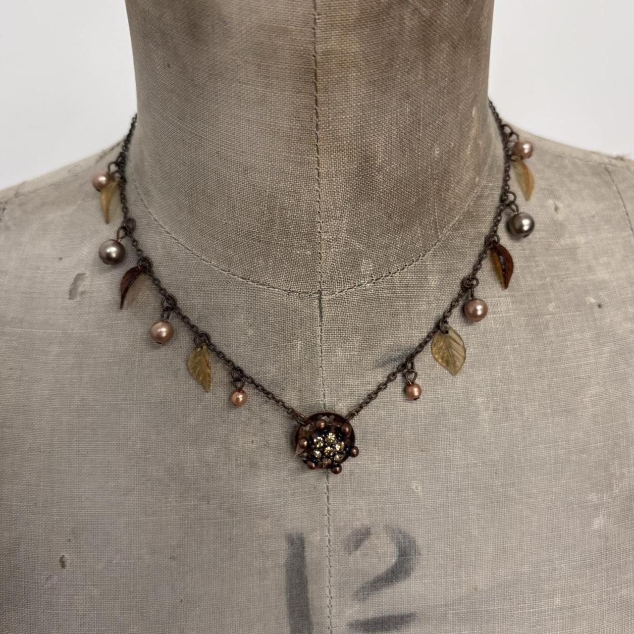 Brown metal hanging fairy necklace