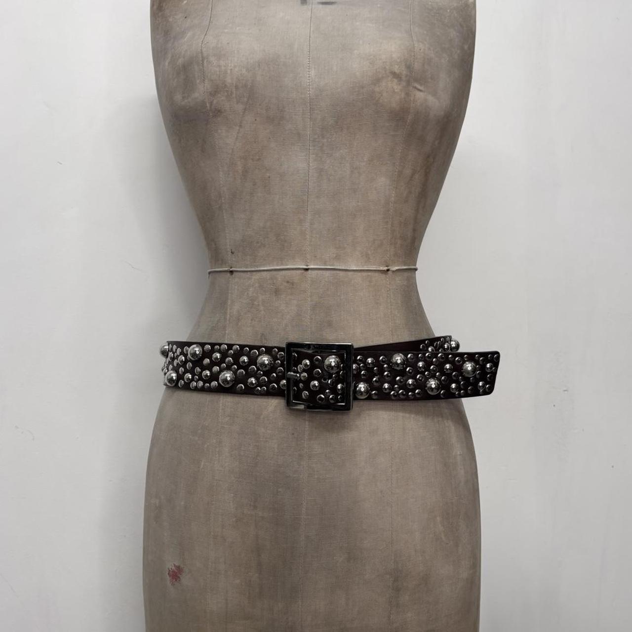 Studded silver eyelet belt