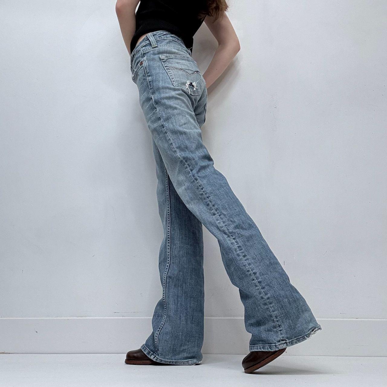 Distressed flared leg low rise jeans