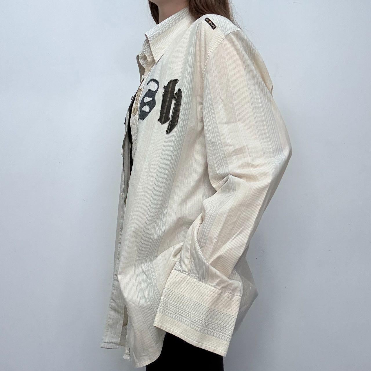 Pinstriped flared graphic shirt