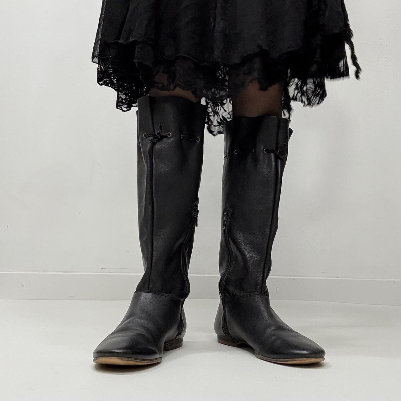 Slouchy black leather knee high boots