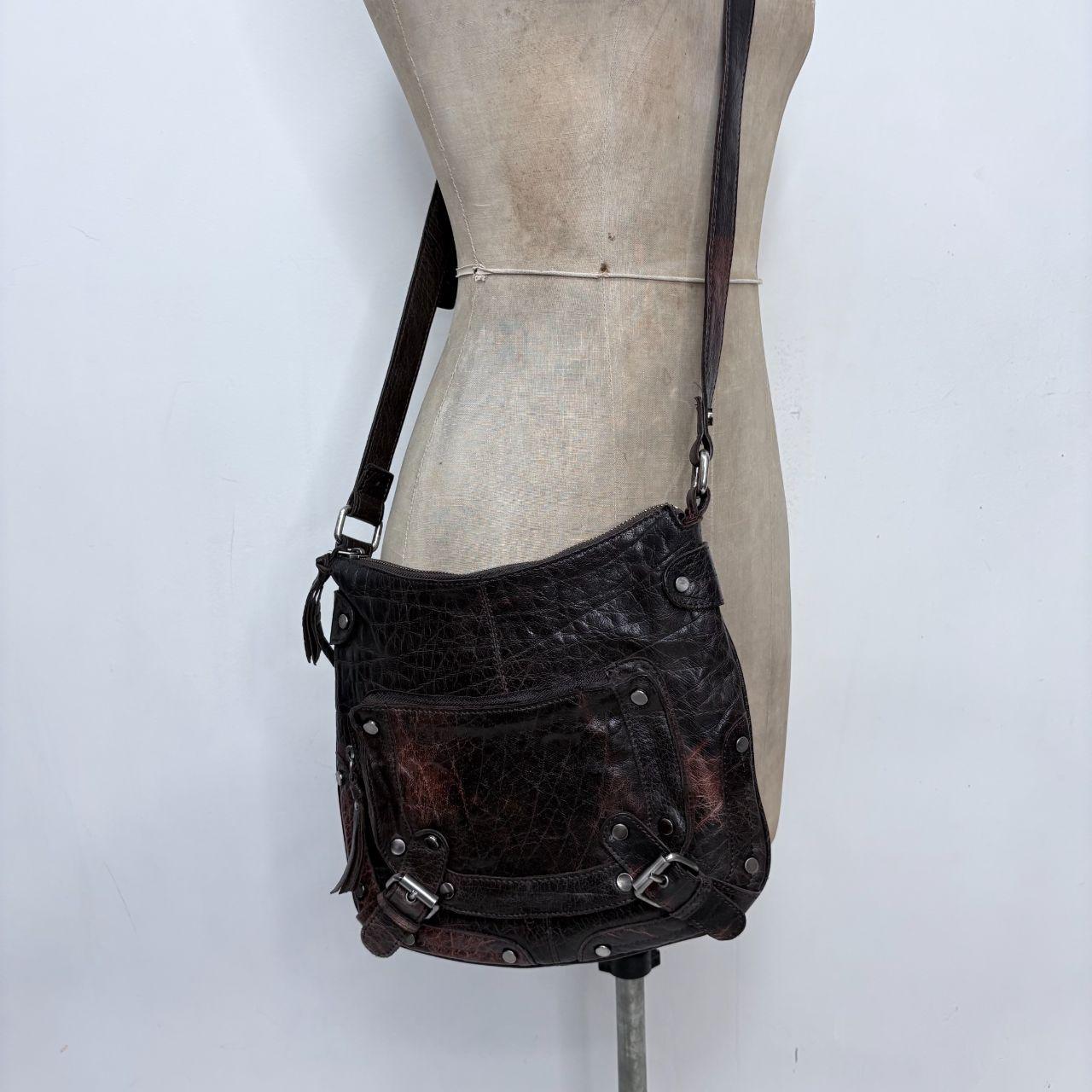 Distressed brown leather buckle studded bag