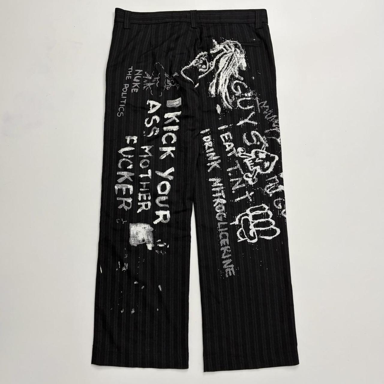 Black pinstripe graphic text trousers