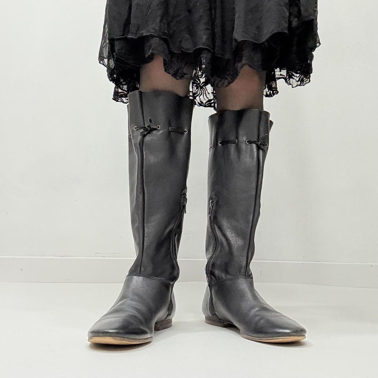 Slouchy black leather knee high boots