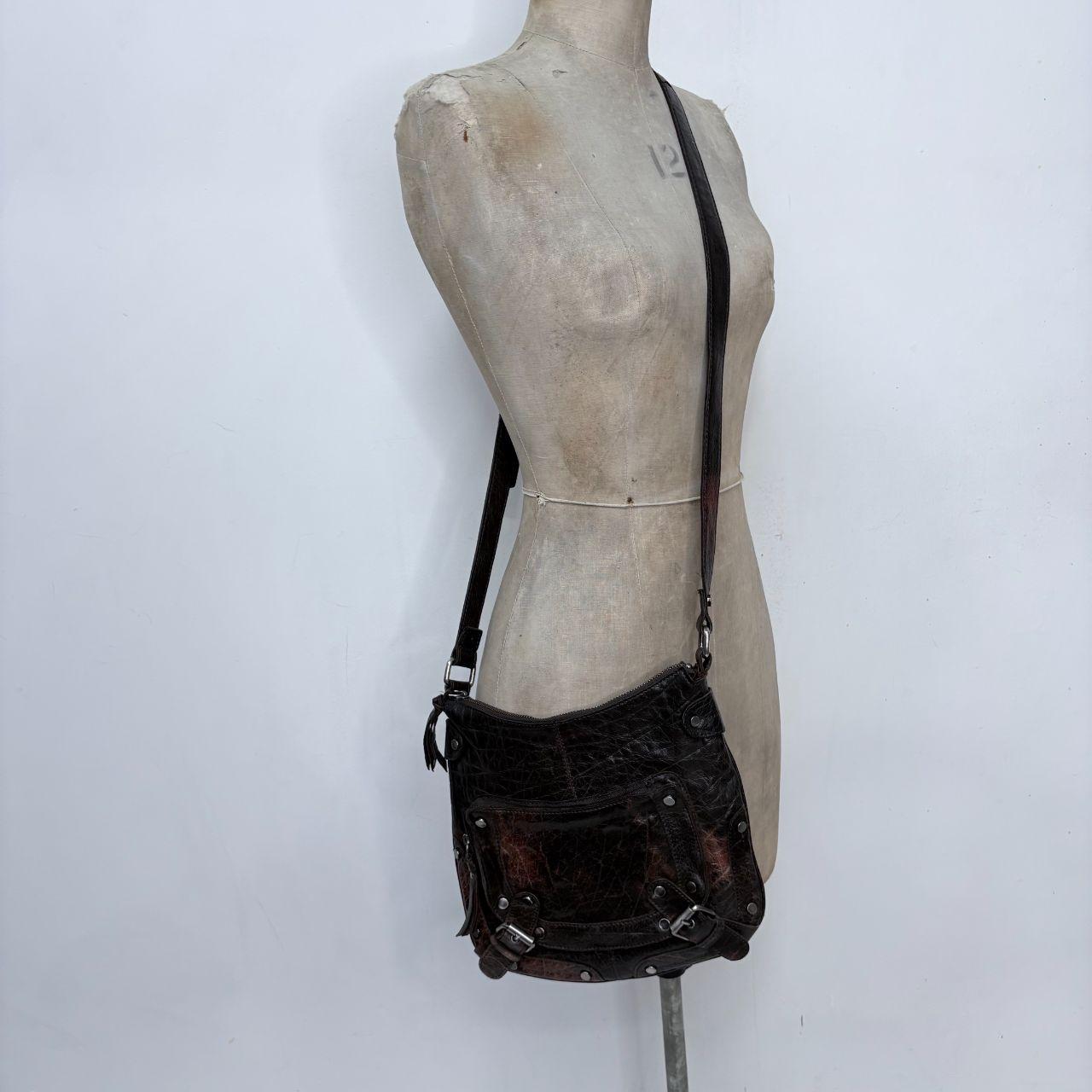 Distressed brown leather buckle studded bag