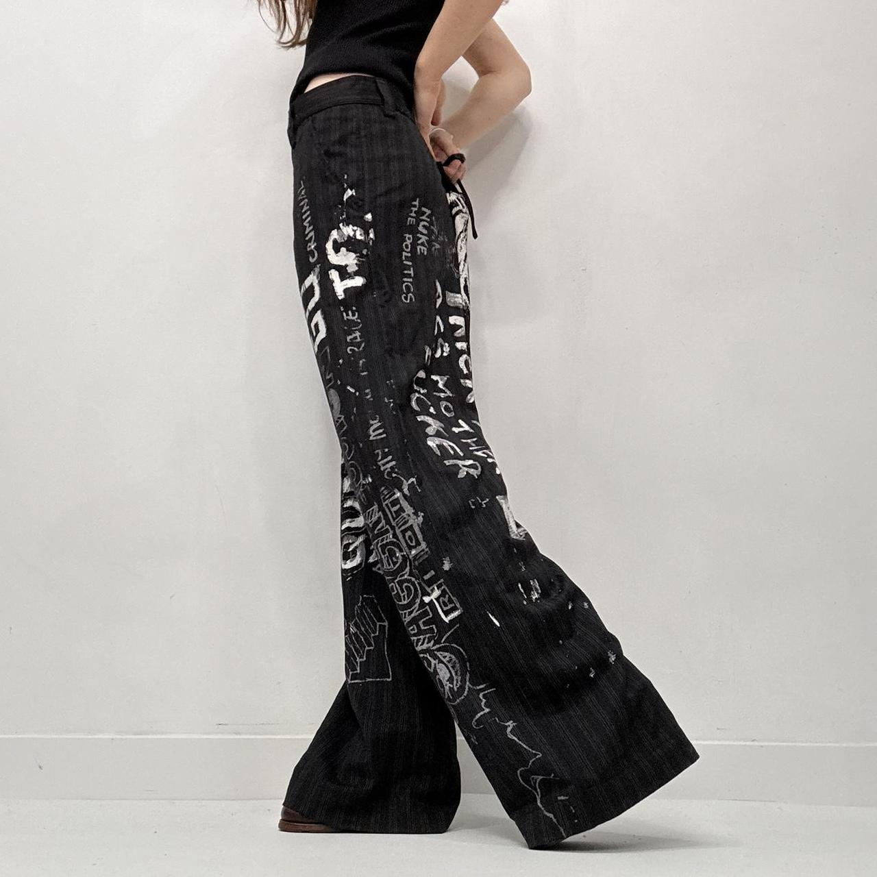 Black pinstripe graphic text trousers