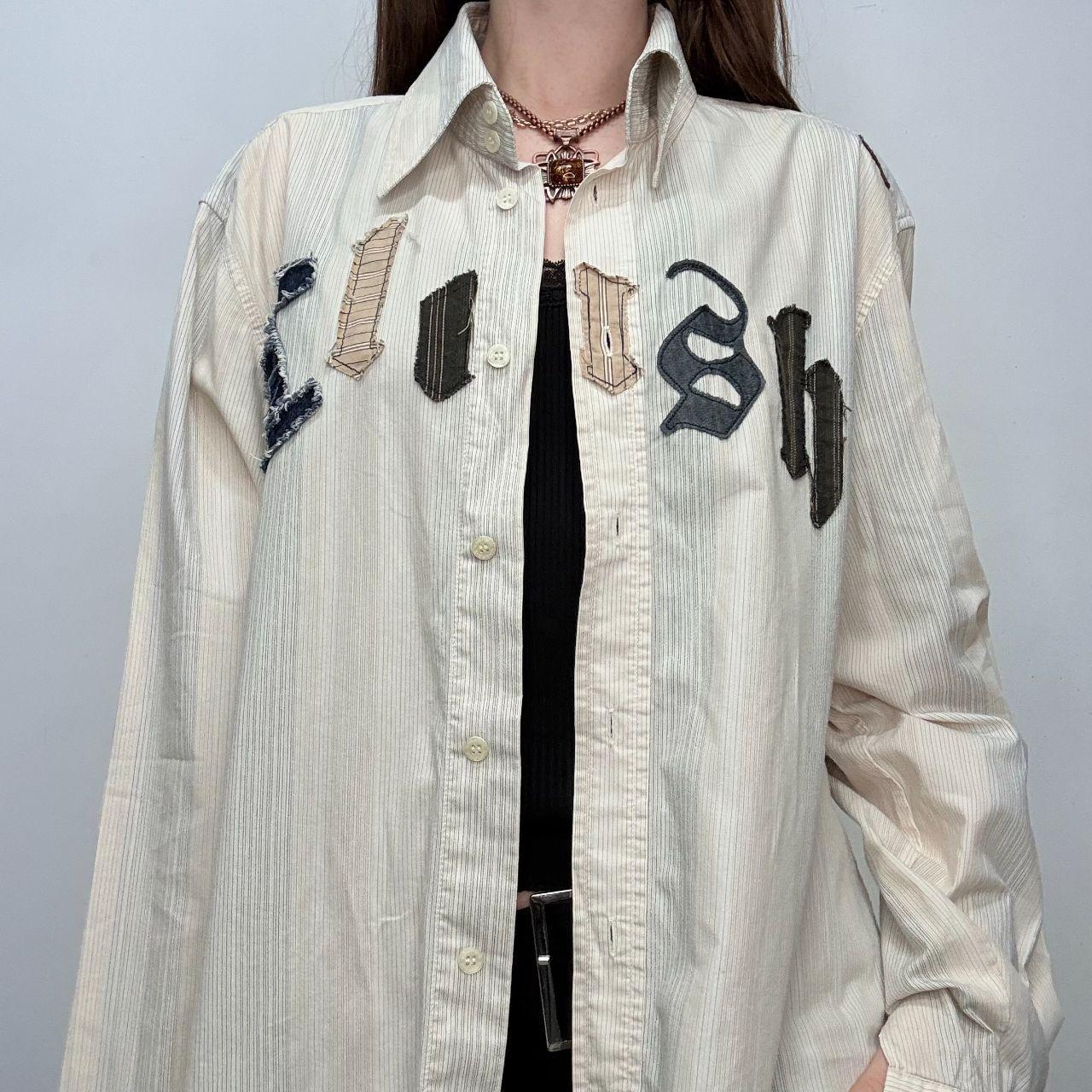 Pinstriped flared graphic shirt