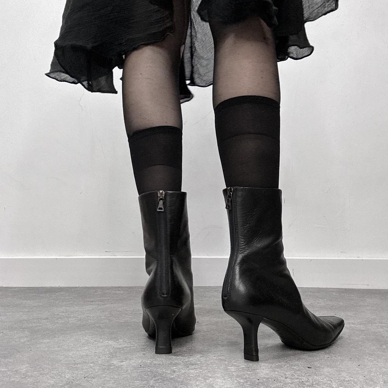 Black pointed heel Prada boots