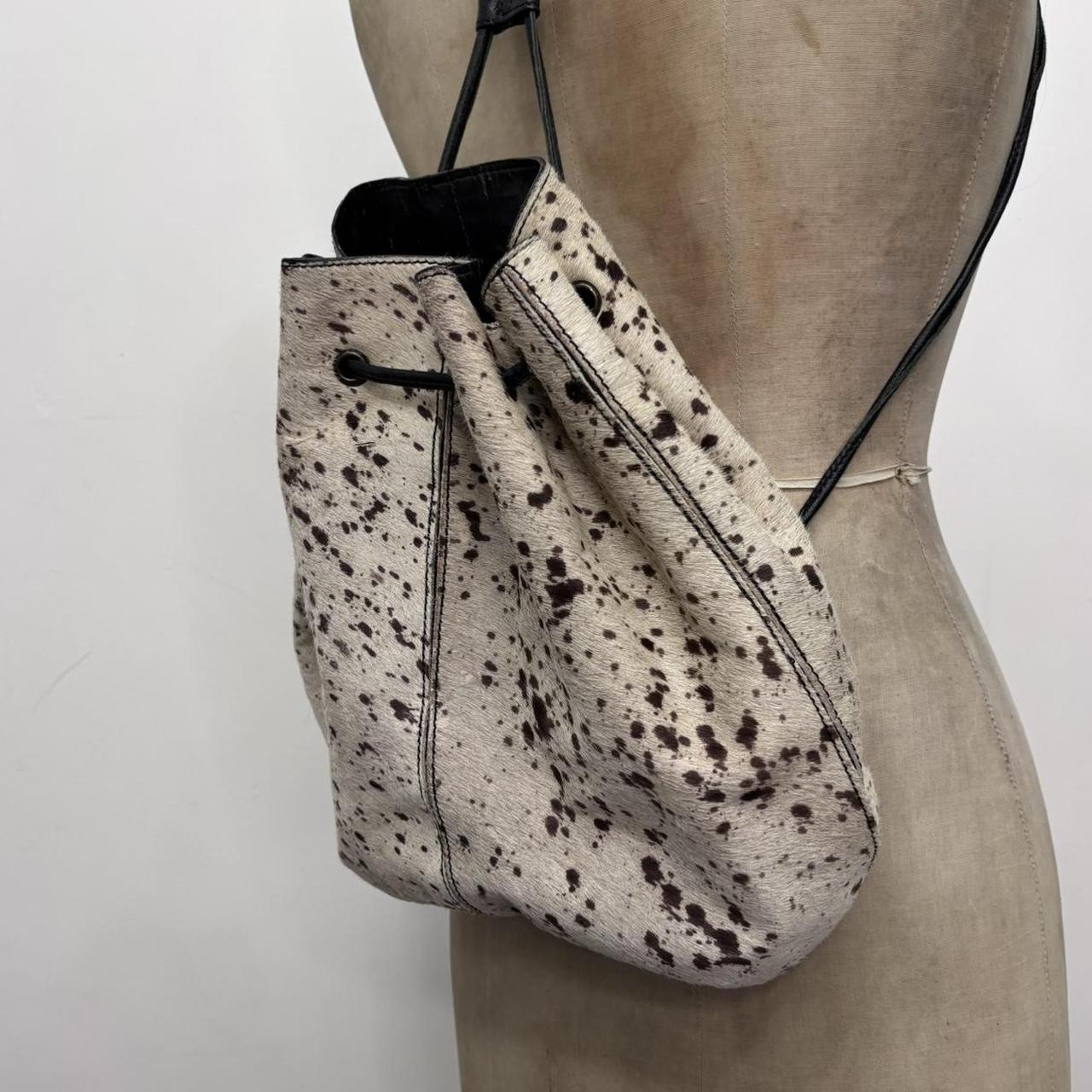 Drawstring cowhide leather backpack