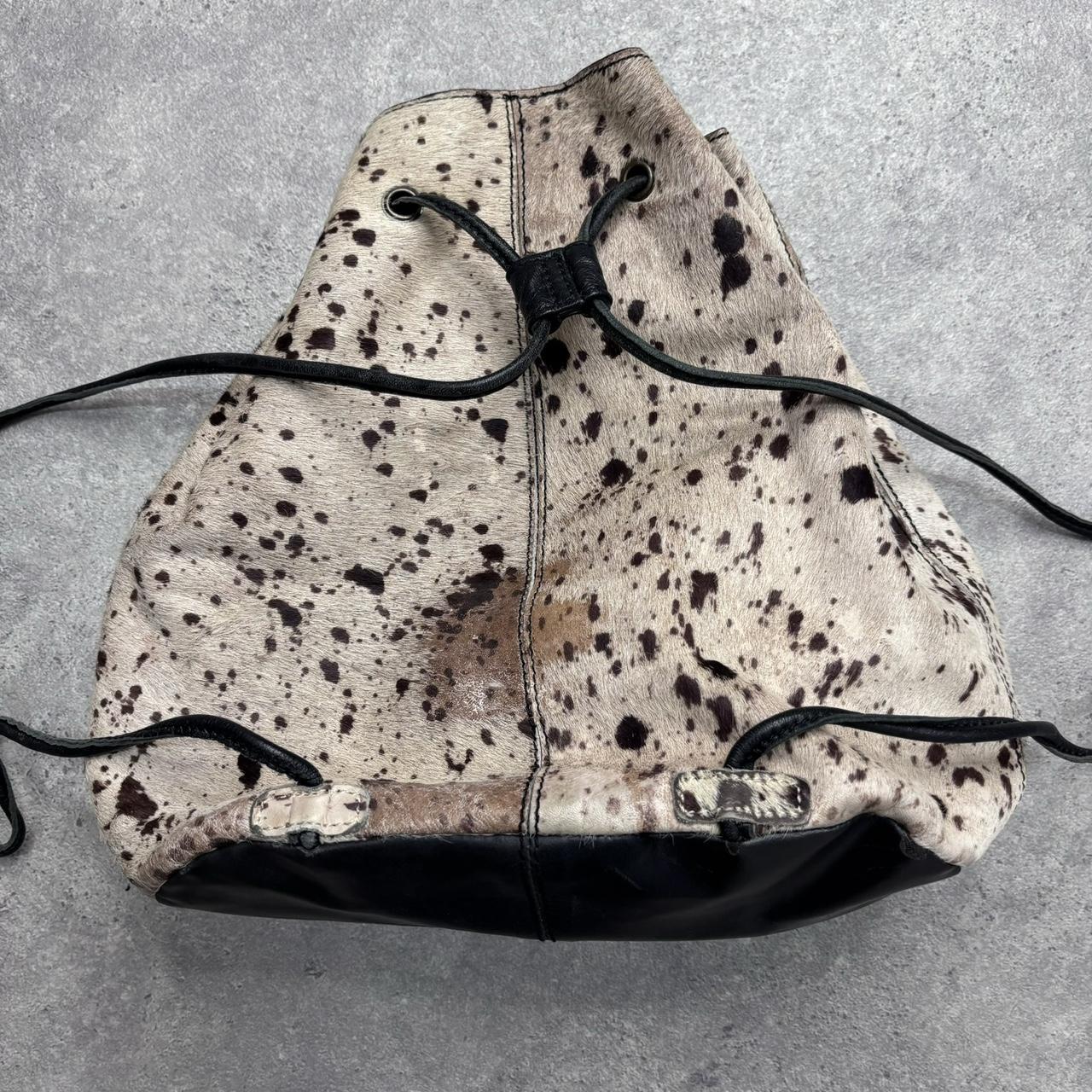 Drawstring cowhide leather backpack
