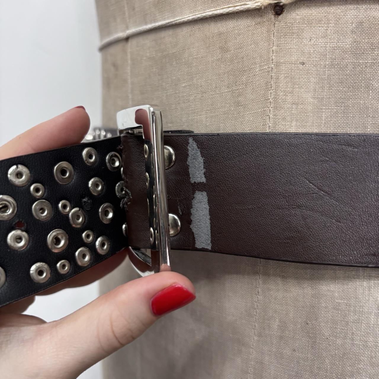 Studded silver eyelet belt