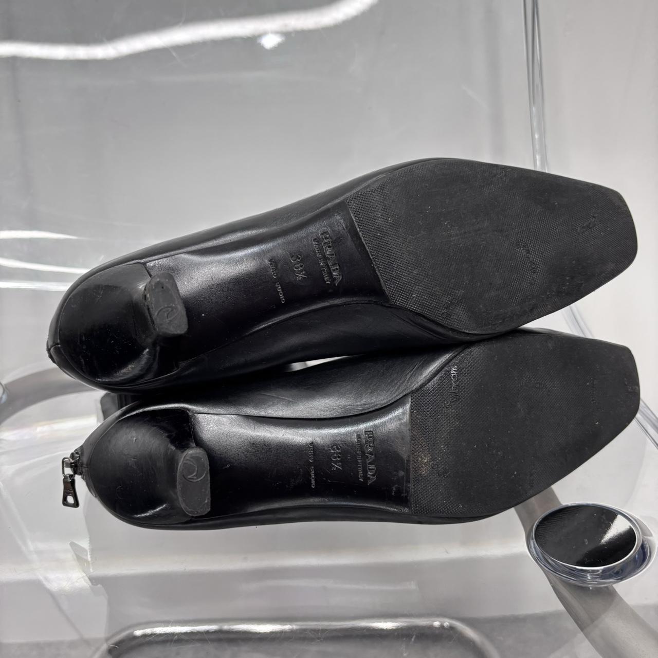 Black pointed heel Prada boots