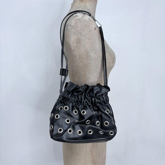 Black eyelet studded cinch bag