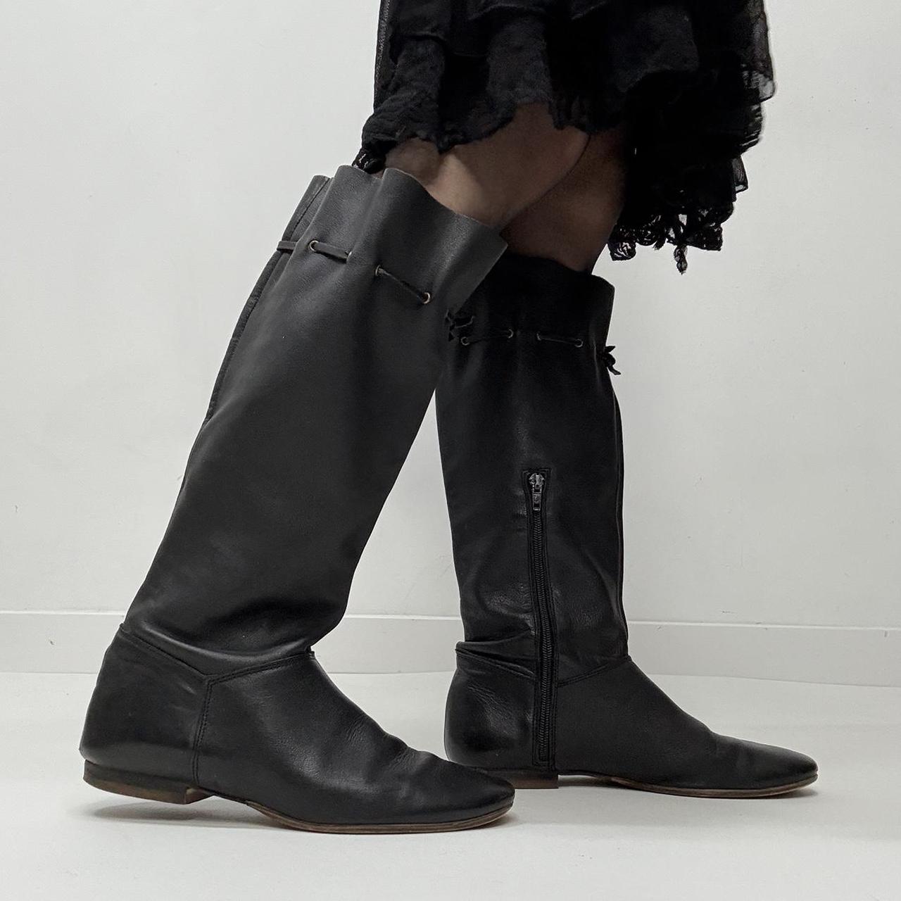 Slouchy black leather knee high boots