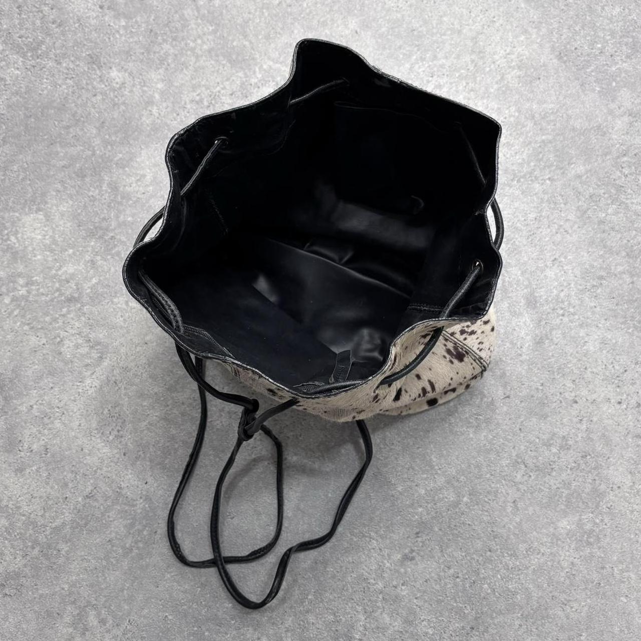 Drawstring cowhide leather backpack