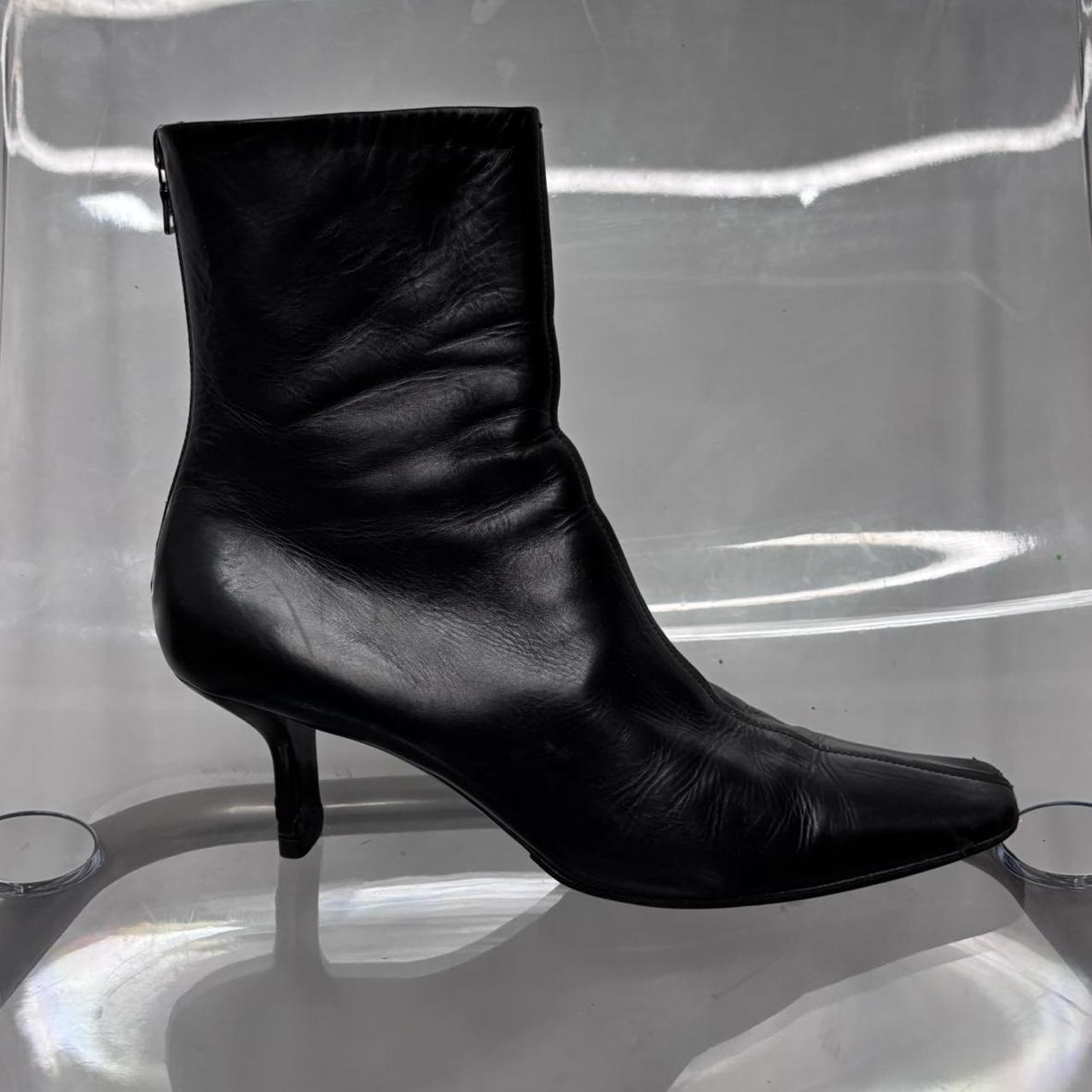 Black pointed heel Prada boots