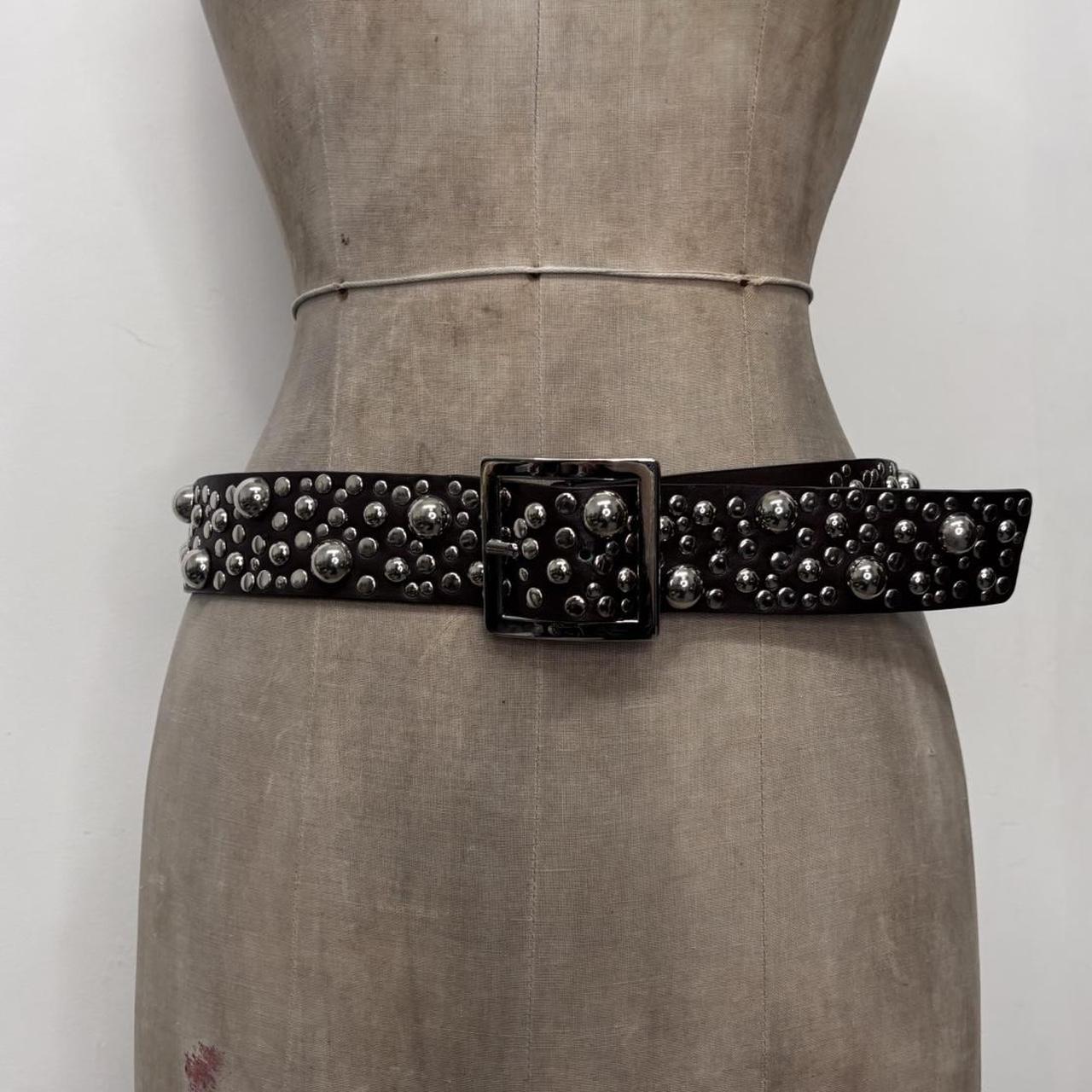 Studded silver eyelet belt