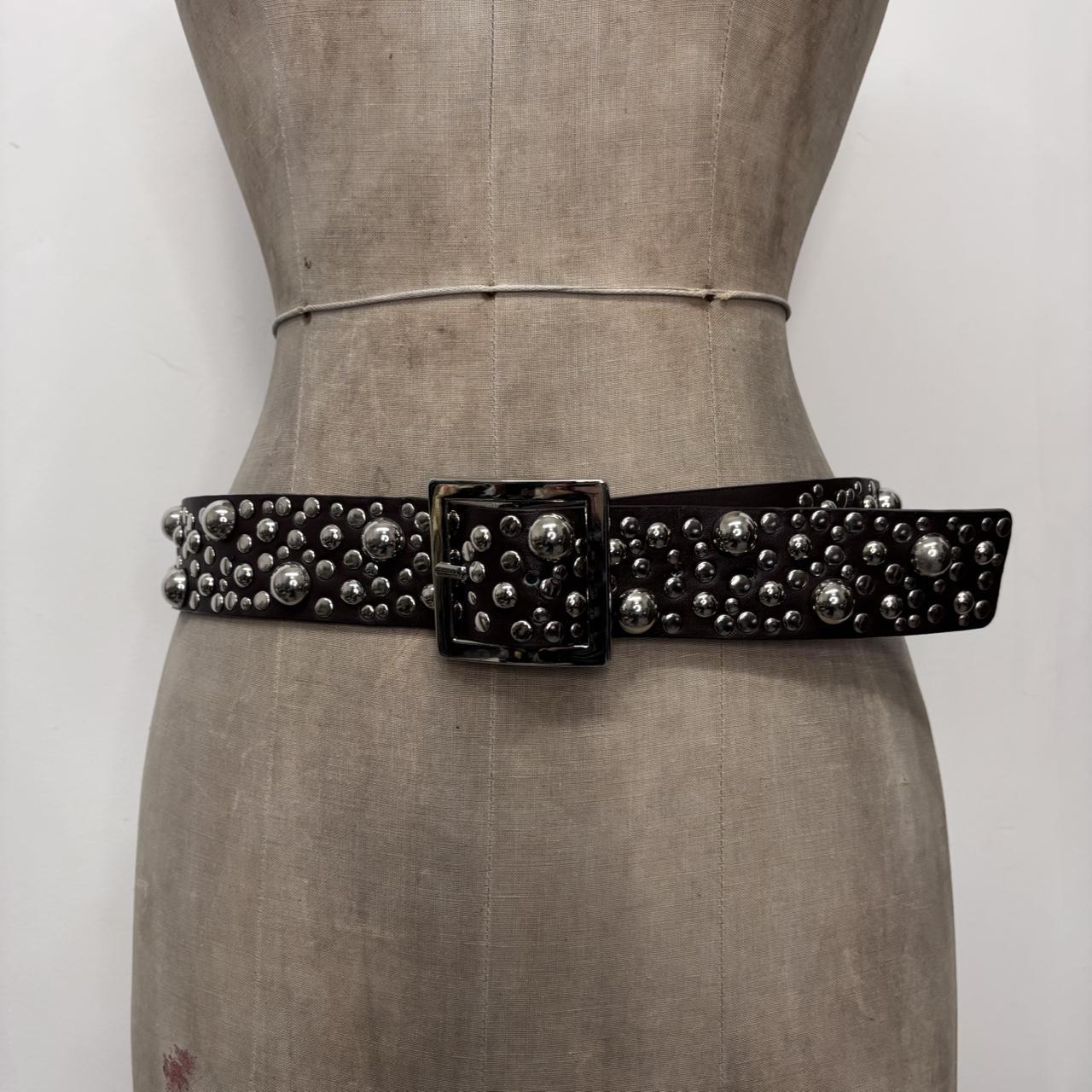Studded silver eyelet belt