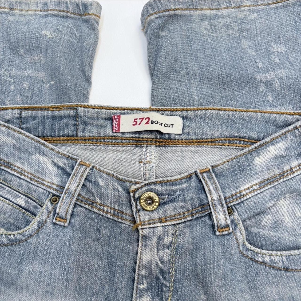 Distressed flared levi's jeans