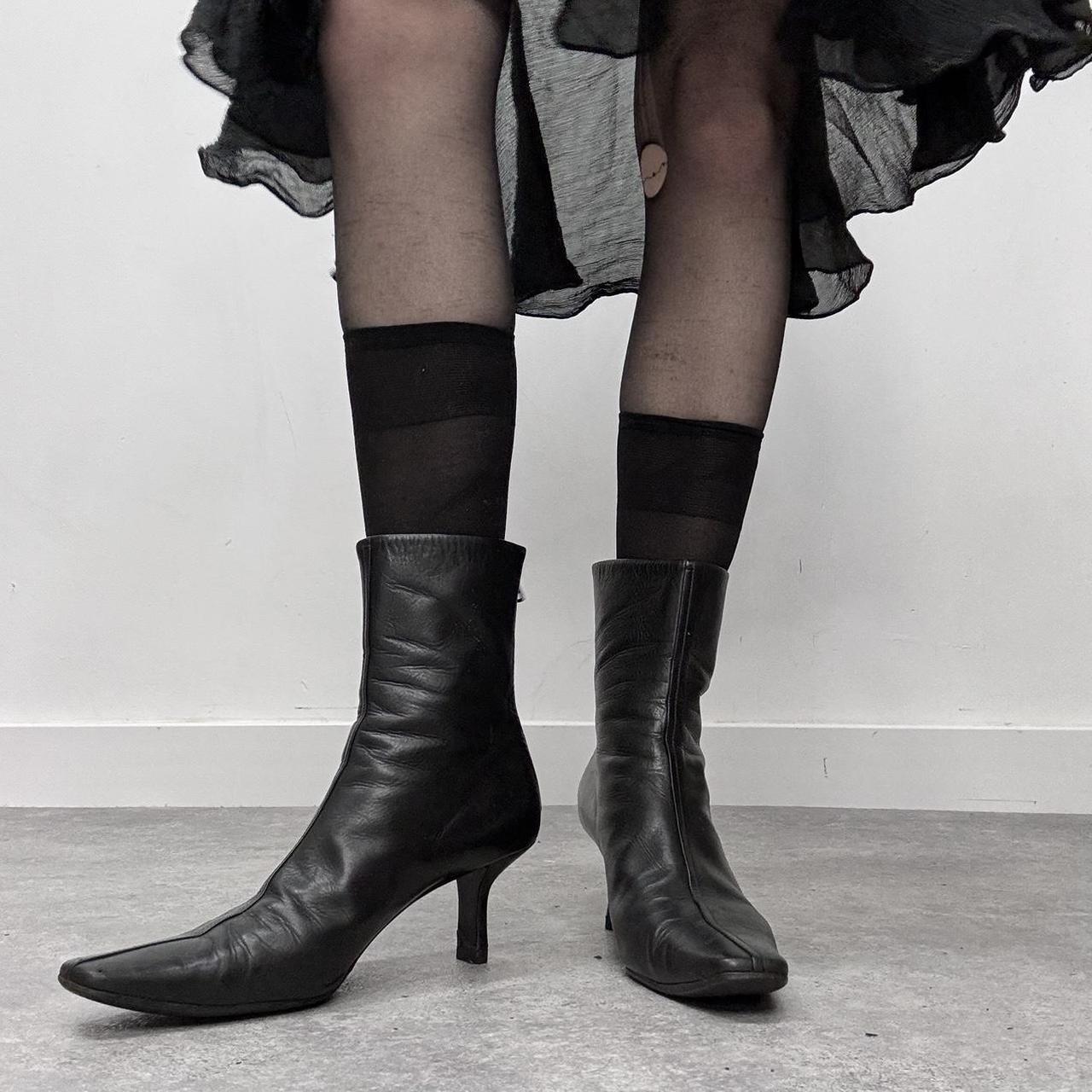 Black pointed heel Prada boots