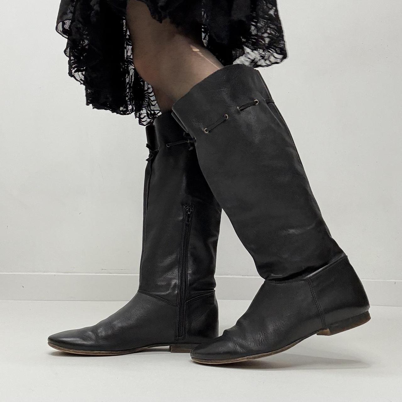 Slouchy black leather knee high boots