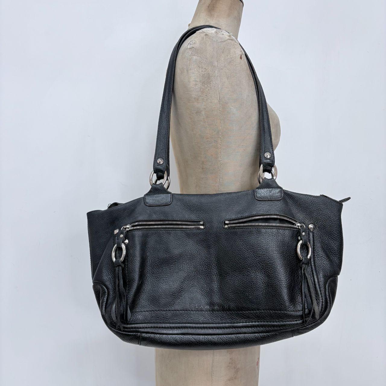Black leather slouchy tassel bag