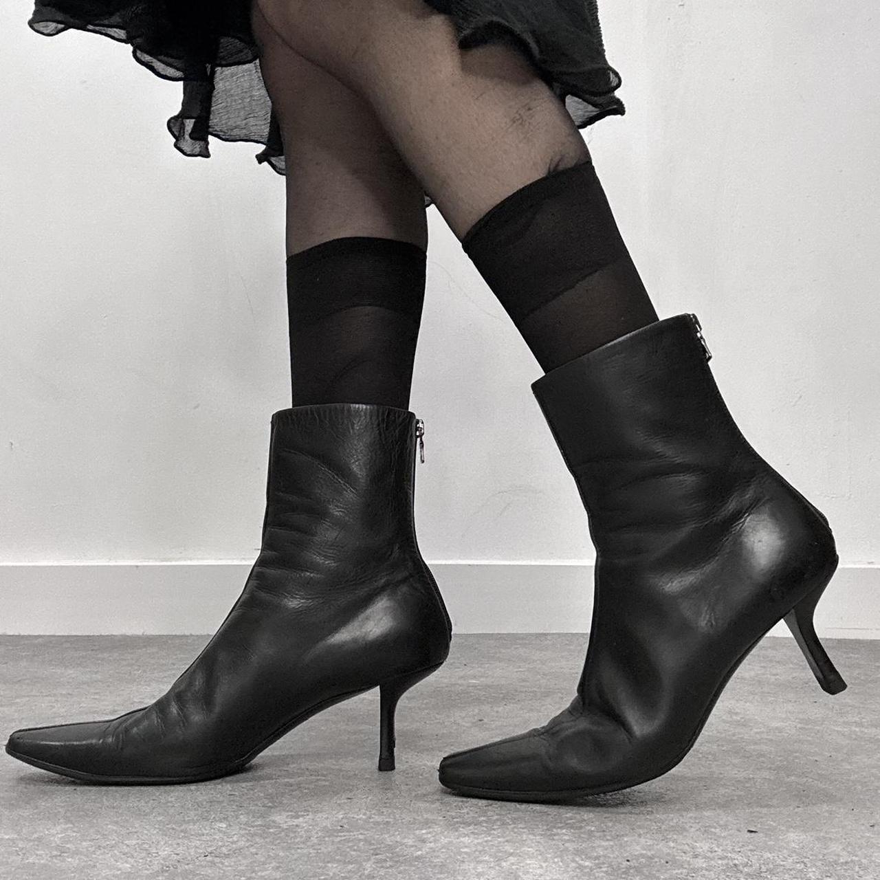Black pointed heel Prada boots