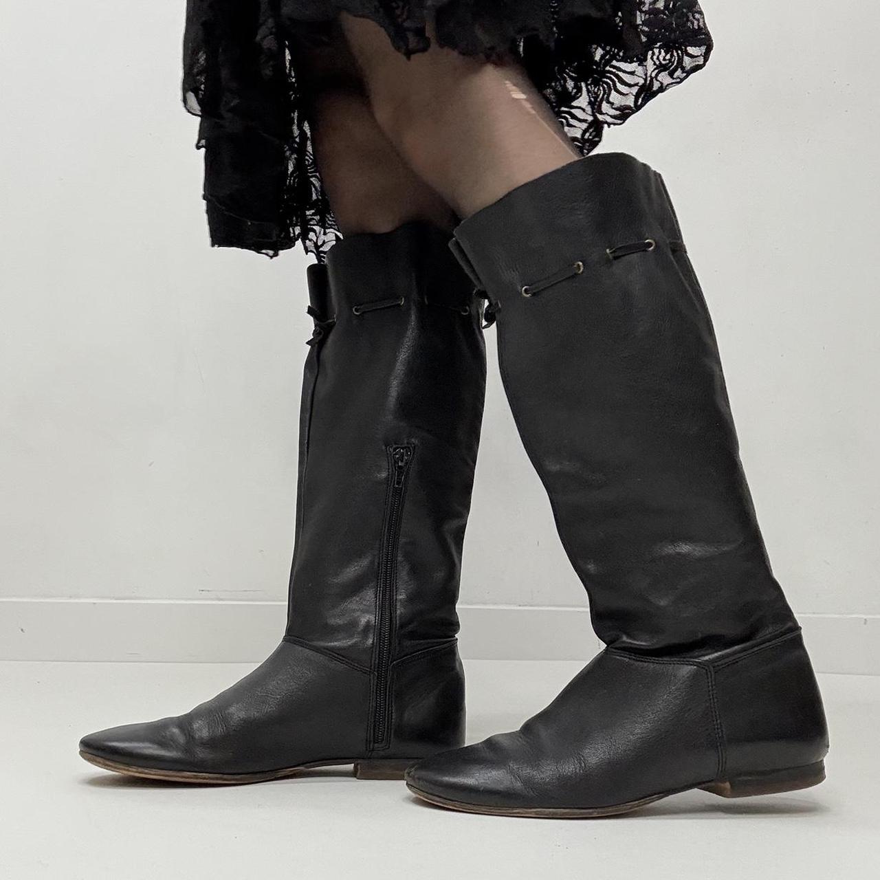 Slouchy black leather knee high boots