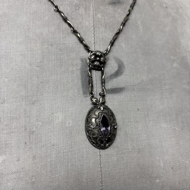 Ornate silver gemstone necklace