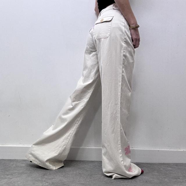 Flared beige wide leg printed trousers