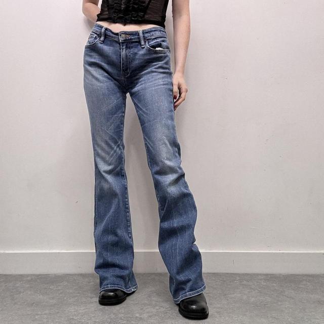 Flared distressed denim jeans
