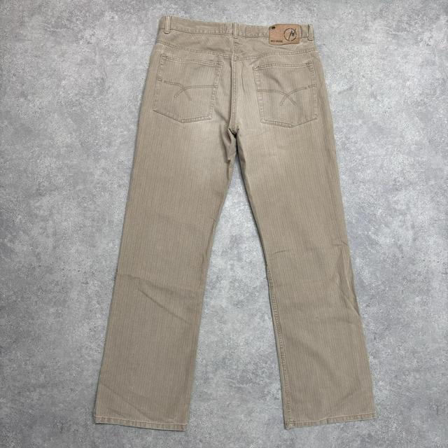 Distressed wash beige jeans