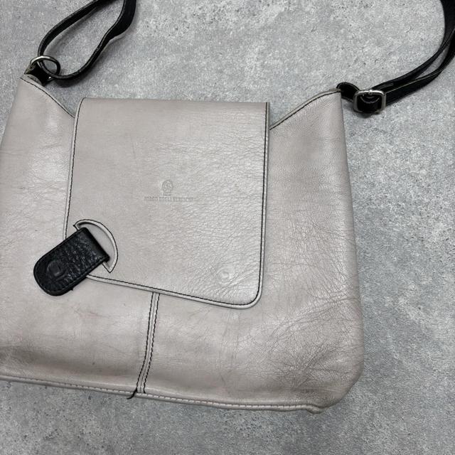 Asymmetrical leather cross-body bag