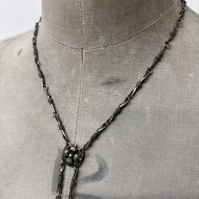Ornate silver gemstone necklace