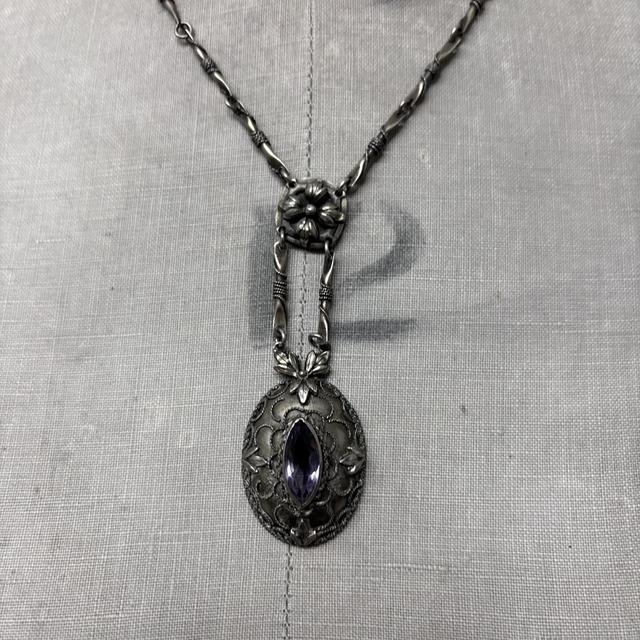 Ornate silver gemstone necklace