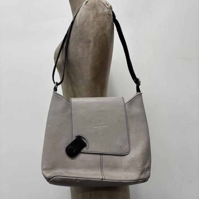 Asymmetrical leather cross-body bag