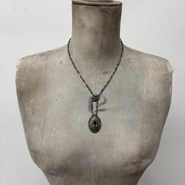 Ornate silver gemstone necklace