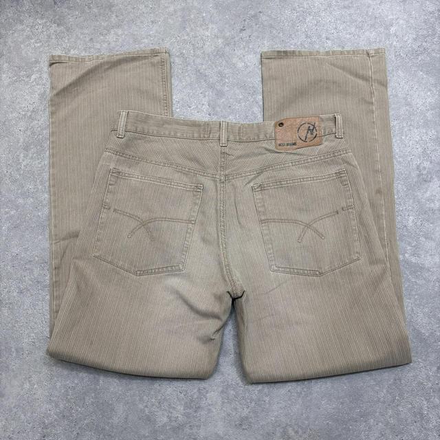 Distressed wash beige jeans